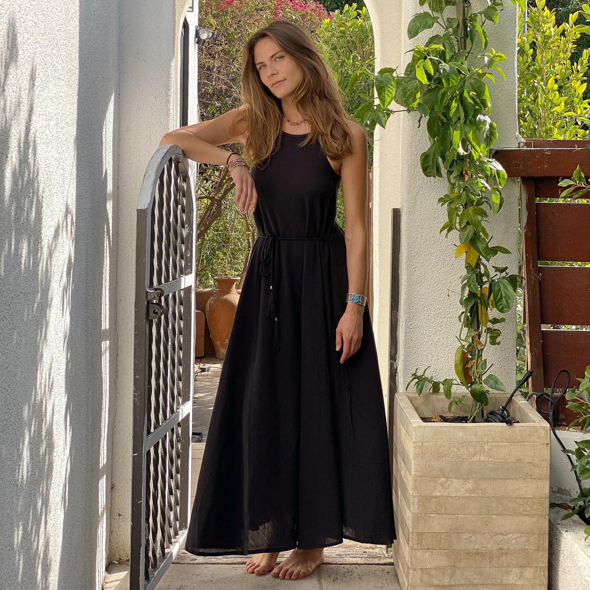 Callie Maxi Dress is just the kind of easy, no-fuss piece you'll want to pack for vacations. It's suspended from narrow straps and has coordinating ones with tassels at the waist to cinch the relaxed silhouette. Wear it to poolside lunches or while browsing local markets.