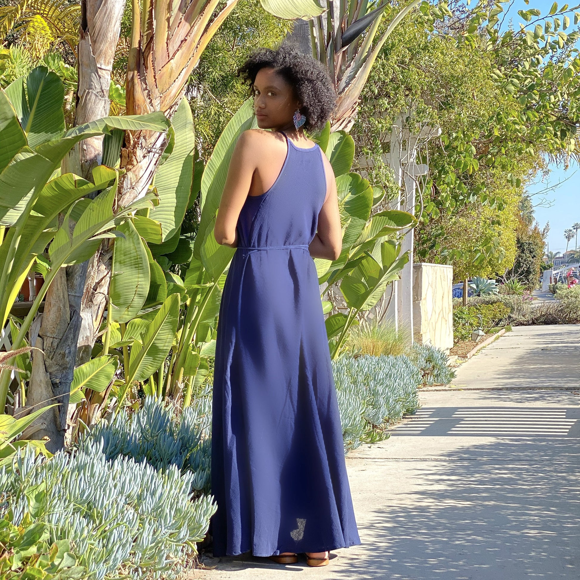 Callie Maxi Dress is just the kind of easy, no-fuss piece you'll want to pack for vacations. It's suspended from narrow straps and has coordinating ones with tassels at the waist to cinch the relaxed silhouette. Wear it to poolside lunches or while browsing local markets.