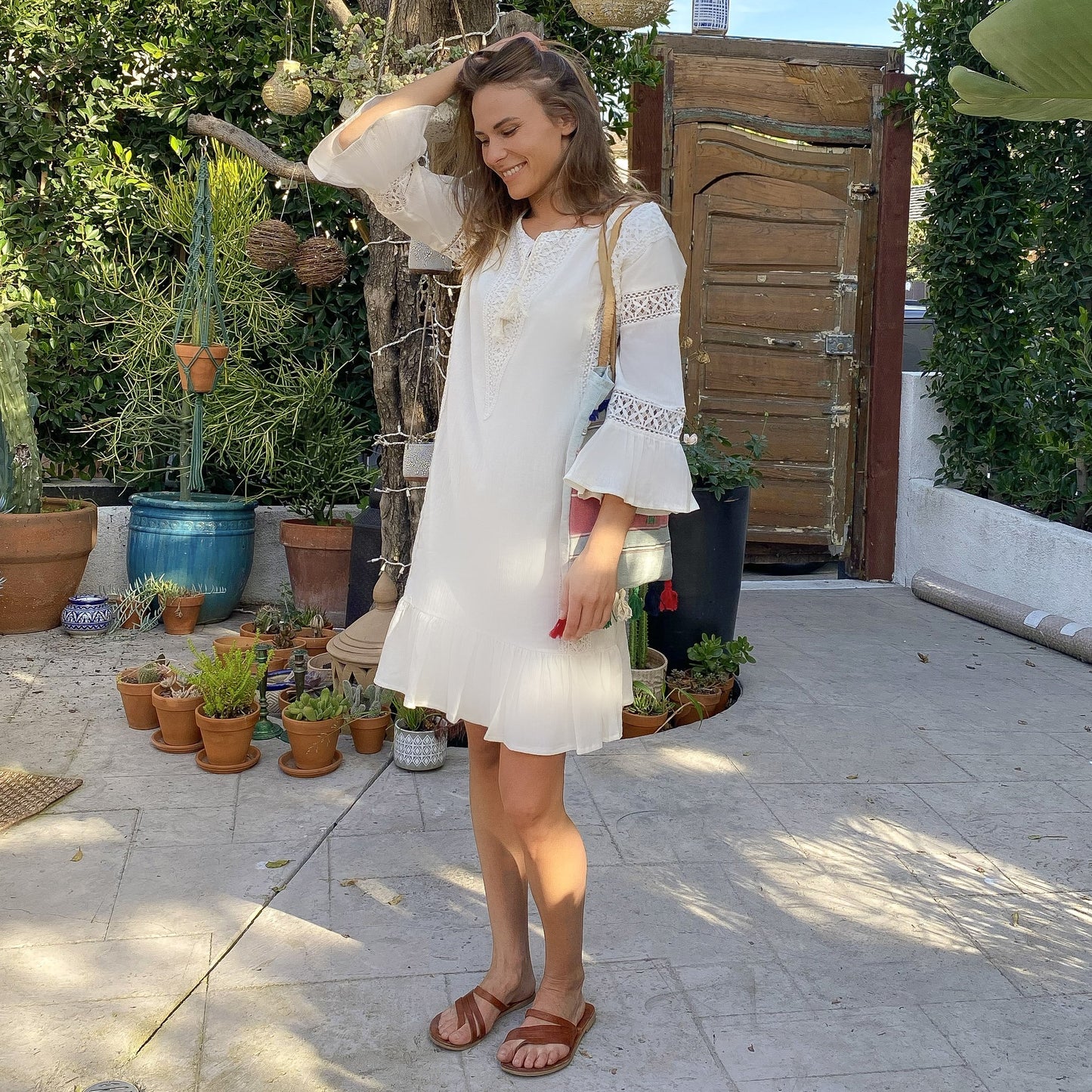 Paradiso Tunic Dress is spliced with romantic lacework. Made from breezy cotton-gauze, it’s cinched in the back to define the relaxed silhouette, has ruffles at the cuffs and the hem. Wear yours on vacation with sandals or mid-heeled shoes.